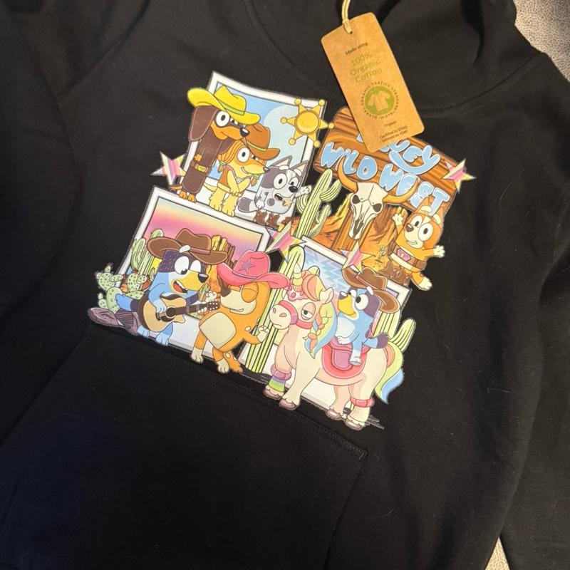 Wild West dog black hoody for children, picture detail is on the chest and the back of the one arm. The hoodie is made from organic cotton