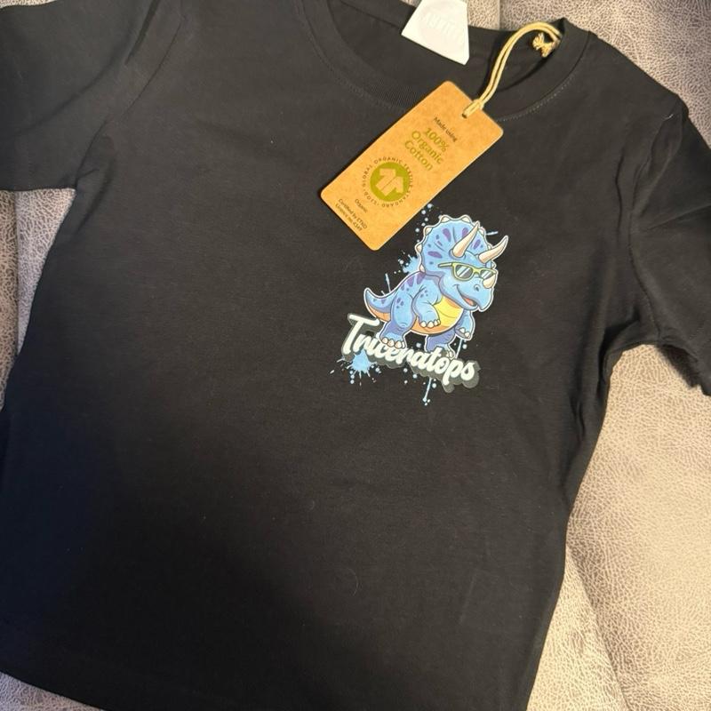 Dinosaur T-shirt with Small Pocket Sized Image on Front and Large Prehistoric Edition Image on Back. Made with organic cotton