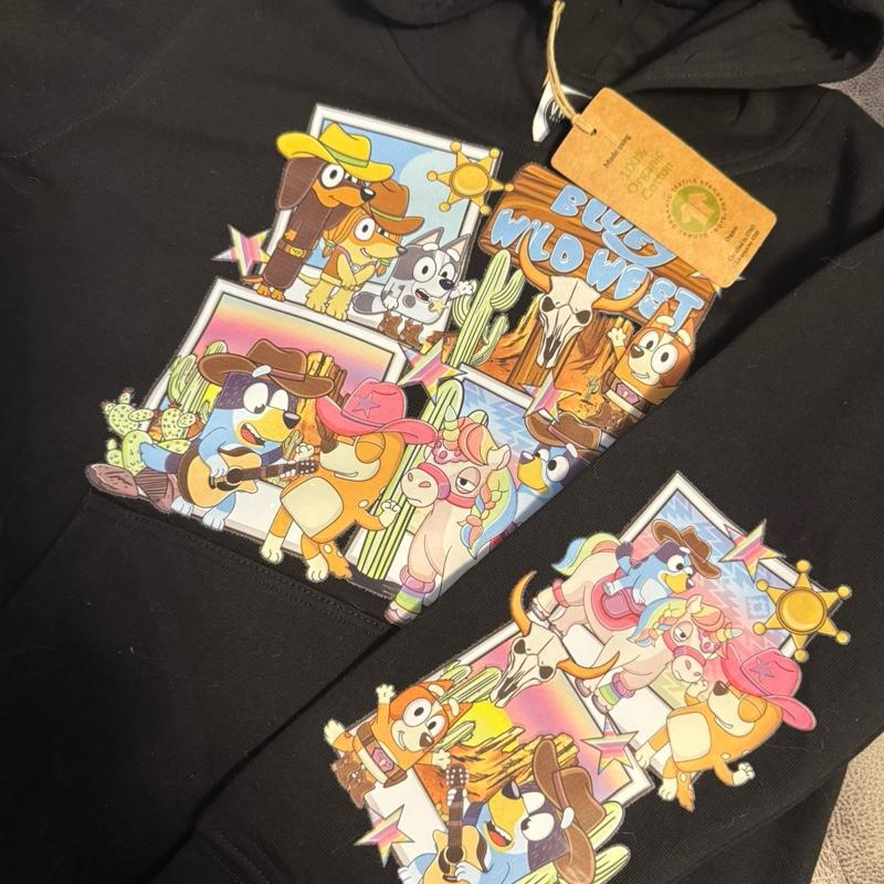Wild West dog black hoody for children, picture detail is on the chest and the back of the one arm. The hoodie is made from organic cotton