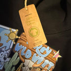 Wild West dog black hoody for children, picture detail is on the chest and the back of the one arm. The hoodie is made from organic cotton
