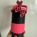 Personalised 500ml can holder/can cooler in pink and black with straw topper and can opener