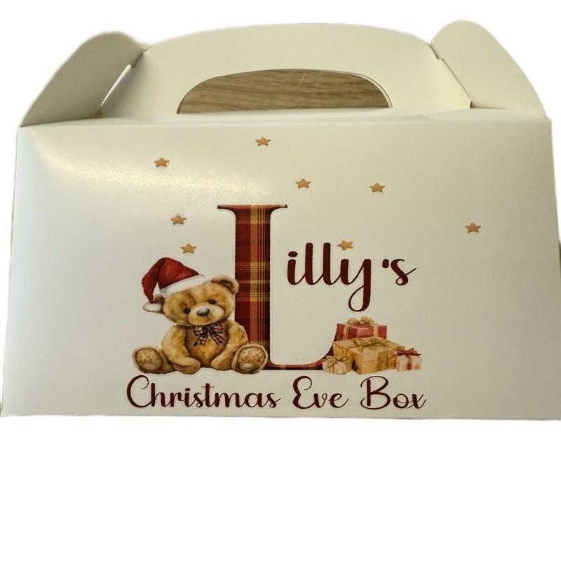 Cardboard party boxes in white with a personalised picture on the front perfect for a Christmas Eve box.