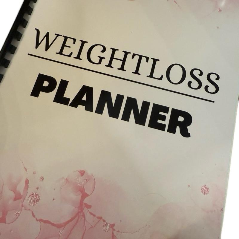 weight loss planner/journal with 15 different pages included to keep you on track
